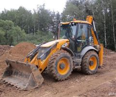 Аренда экскаватора погрузчика с гидромолотом